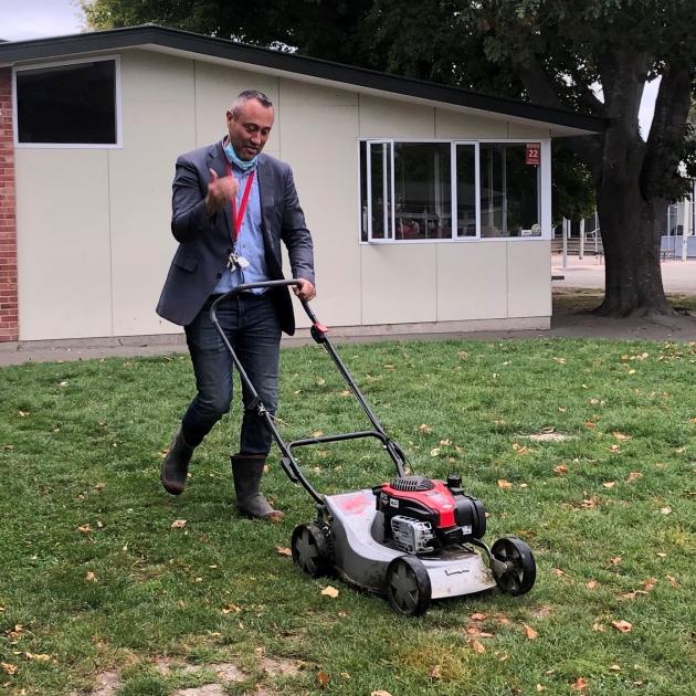 Micah Hocquard mowing the school lawn. Photo: Supplied