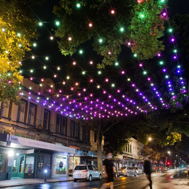 Rainbow lights glow, festooned in the dark over a section of George St early yesterday as part of...