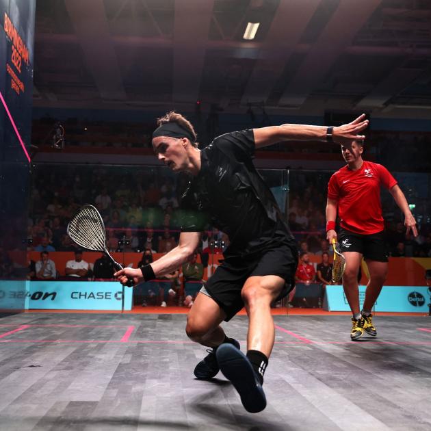 New Zealand squash player Paul Coll in action against Wales' Emyr Evans yesterday. PHOTO: REUTERS
