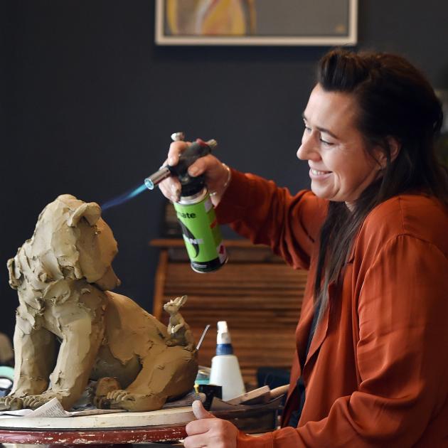 Dunedin artist Kylie Matheson works on one of her clay sculptures in her Dunedin home. Photo:...