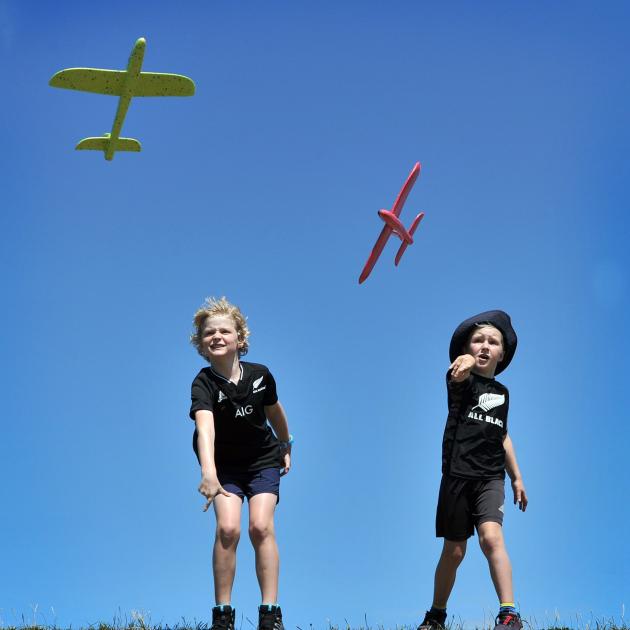 Not afraid of windy weather, Daniel Eastough (8) and Roman Winstanley (6) test Christmas coloured...