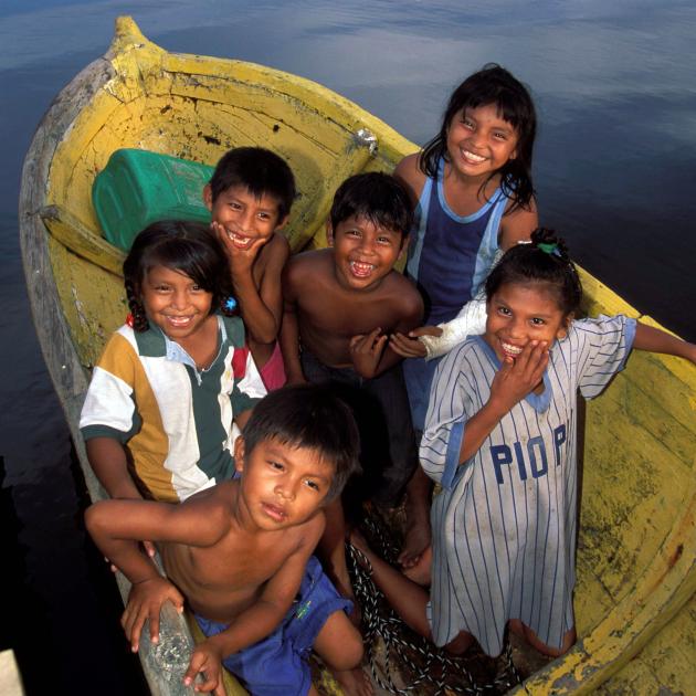 Friendly local children near the Panama Canal have their own boat transport.