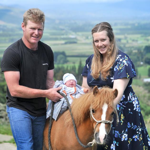 The first baby born in Dunedin Hospital this year, who has yet to be named, sits on Maggie the...