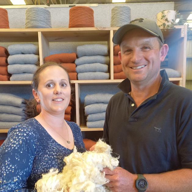 Esta and Tim Naylor hold their Romney lamb’s wool, which has been used to create the jerseys in...
