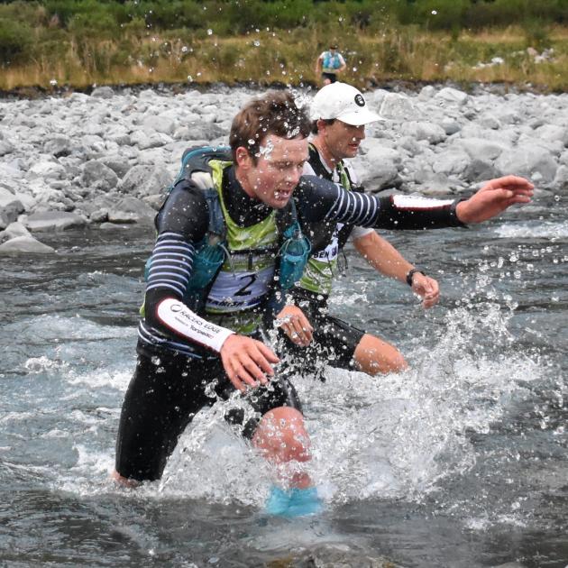 First-time longest-day winner  Hamish Elliott crosses a stream in Deception Valley during...