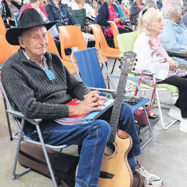 Waiting his turn to play at the festival was Trevor Rigby, of Christchurch, who took up country...
