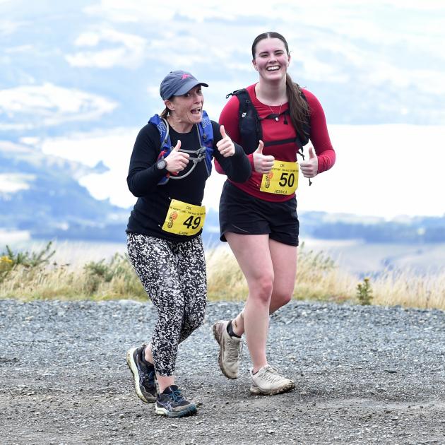 Cathy Bailey (left) and Jessica Kats participate in the Race the Summit 11km event at Mt Cargill...