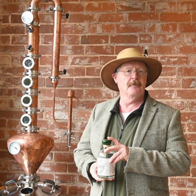Dunedin historian Gregor Campbell showcases a bottle of Dunedin dry gin, at Dunedin Craft...