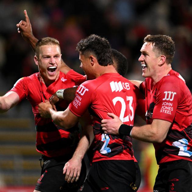 The Crusaders' Johnny McNicholl celebrates scoring a try against the Chiefs. Photo: Getty