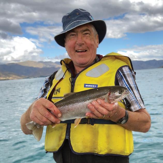 Graeme Smith, QSM, enjoys a successful catch on a family holiday to Lake Benmore in 2019. PHOTO:...