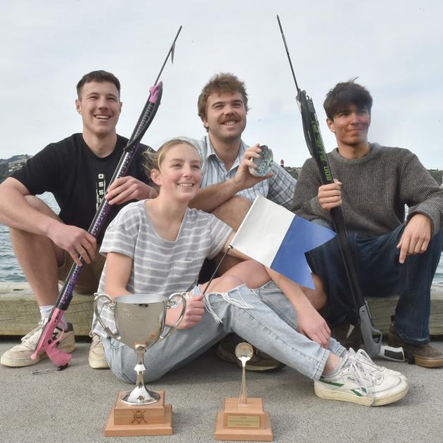 Displaying the silverware up for grabs at the Otago Student Spearfishing and Hunting Club...