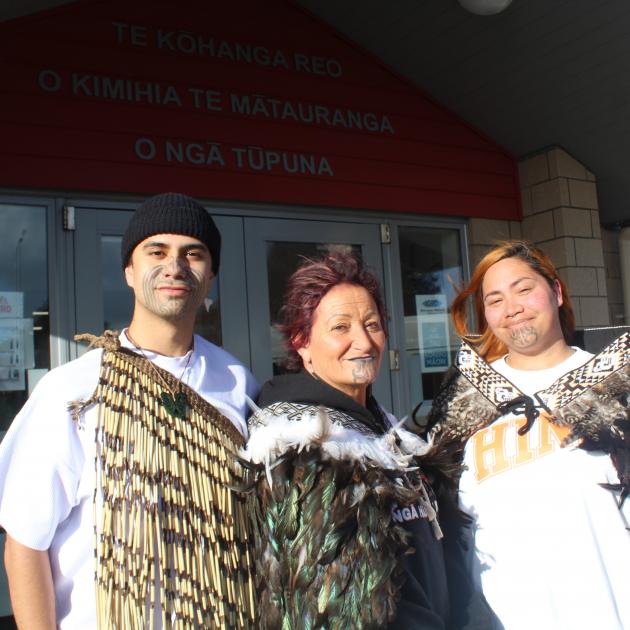 Kalani-Joe Batchelor-Tāta, Debbie Tāta (centre) and Te Āwhina Tāta will graduate as a whānau in...