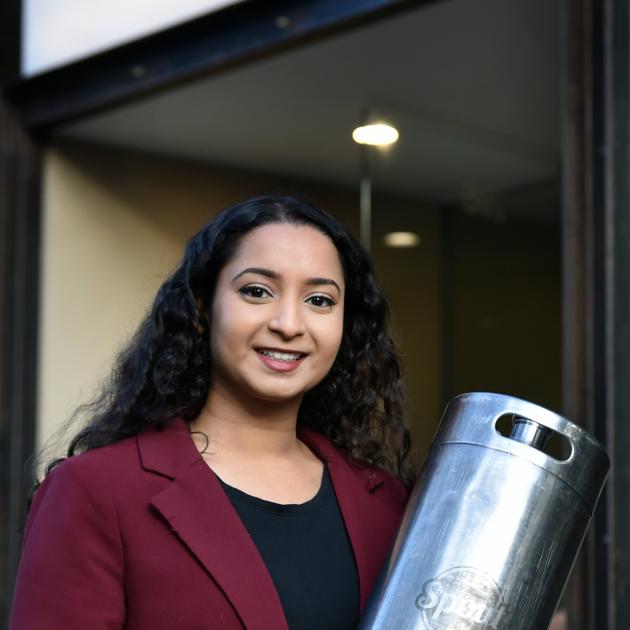 Spout Milk co-founder Jo Mohan with a keg used at Dunedin’s Catalyst cafe. PHOTO: PETER MCINTOSH