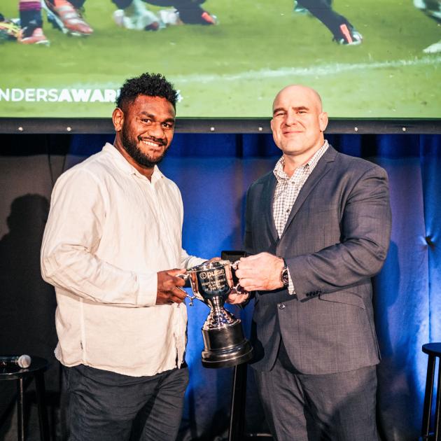 Timoci Tavatavanawai (left) receives his most valuable player award from Highlanders coach Clarke...