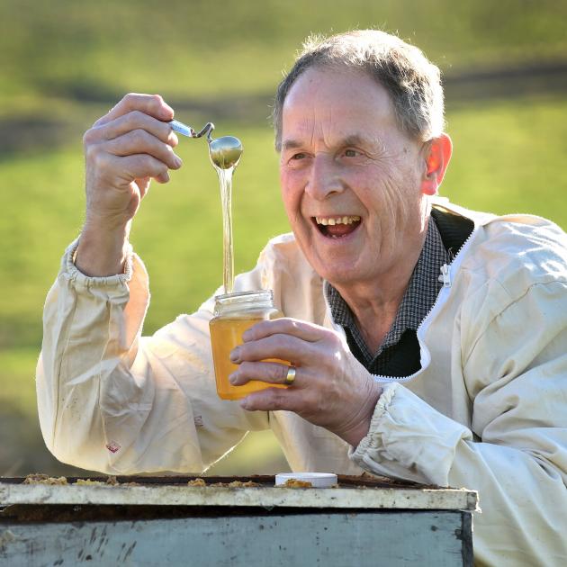 Allan (Allen) McCaw, of Milburn, shows off some of his award-winning honey in 2019. PHOTO: PETER...
