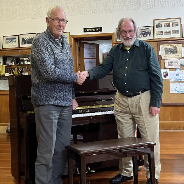 Oamaru Variety Entertainment Club president Ray Walker (left) presents the club’s piano to Oamaru...