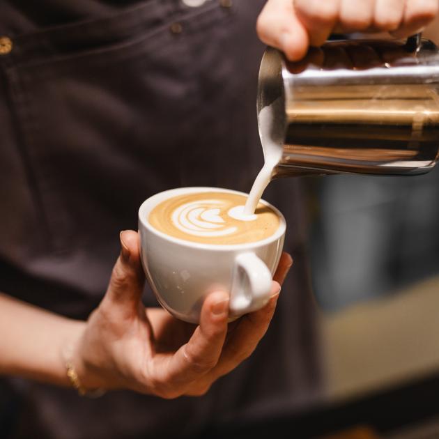 Barista making a coffee at a cafe. Photo: Getty Images Barista making a coffee at a cafe. Photo: Getty Images