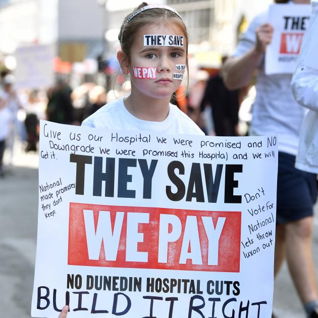 A young protester makes her point during the march on Saturday protesting cuts to the new Dunedin...