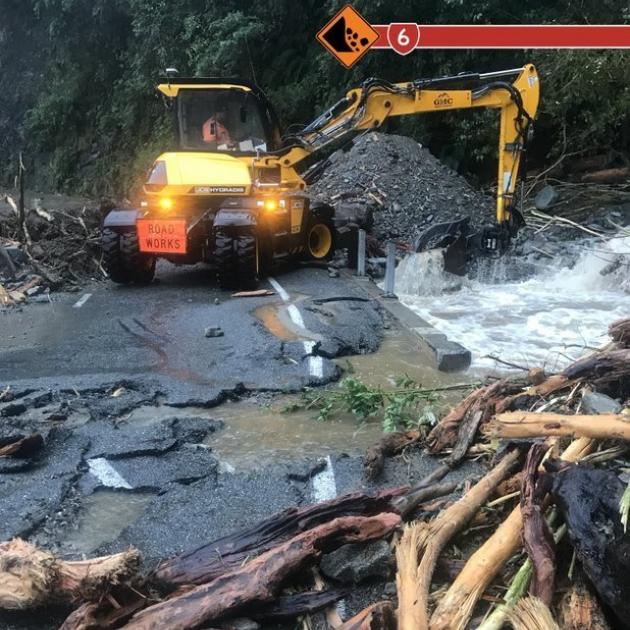 Niwa and MetService were issuing differing weather information as the water rose in the Waiho...