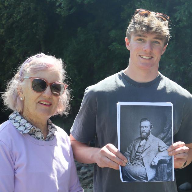 Holding an image of fishing identity Alexander Campbell Begg in Dunedin is his great-great-great...