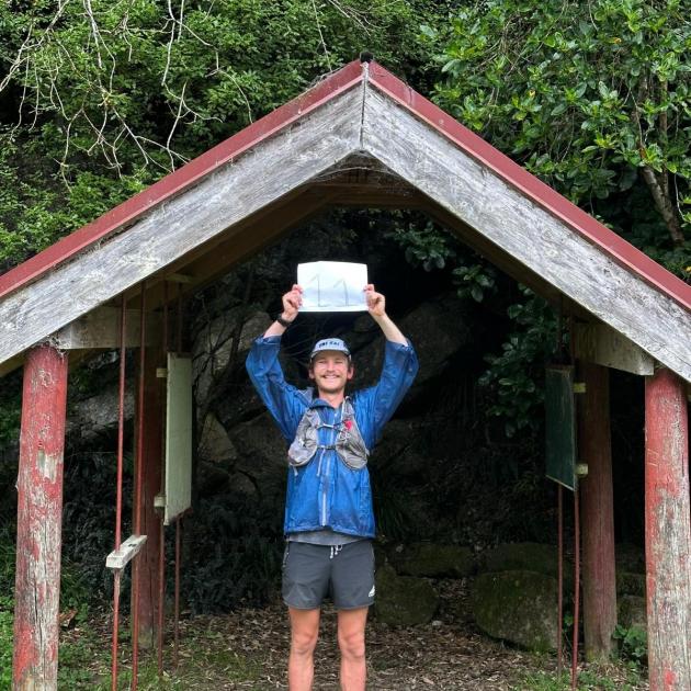 Ben Gatting at the end of the Waikaremoana Track, having run New Zealand’s 11 Great Walks in 11...
