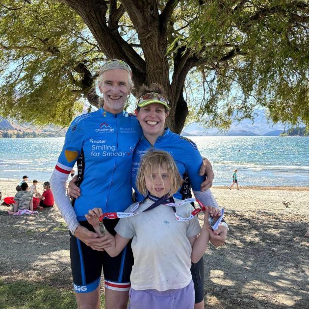 Australian triathletes Mark “Sharky” Smoothy and Alyssa Coe, with their daughter, Estelle, 9,...
