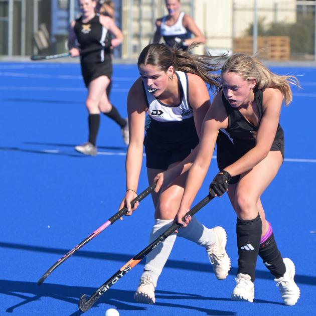 Kings United Royals' Alannah McGuinness (left) pressures Faith McKay, of University Stingrays,...