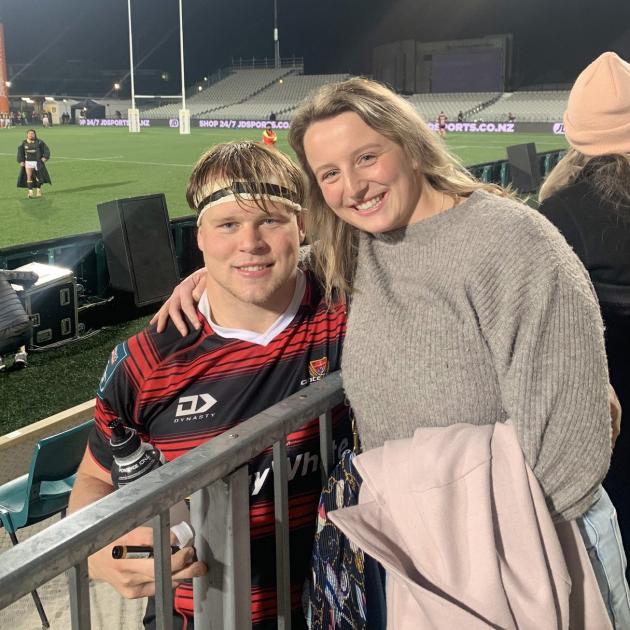 George Bell and sister Lucy celebrate after a Crusaders match in Christchurch. PHOTO: SUPPLIED