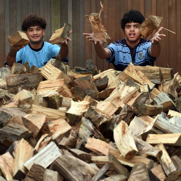 King’s High School students Siaki Ramsay (left), 16, and Nantei Teweti, 15, about to stack a pile...