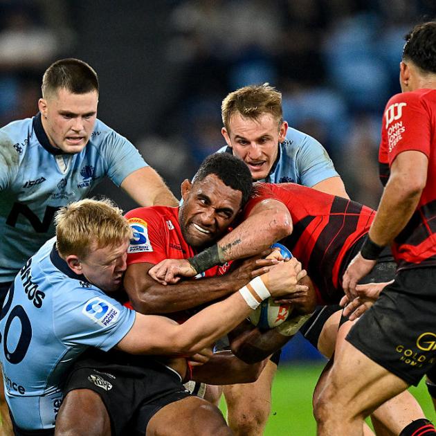 Crusaders wing Sevu Reece is tackled by Hugh Sinclair of the Waratahs. Reece went on to score a...