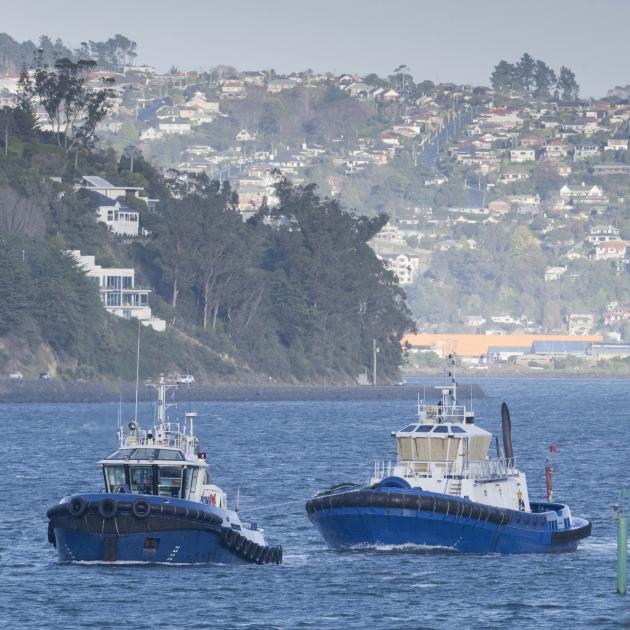 Port Otago tug Arihi tows fellow tug Otago from Dunedin to Port Chalmers yesterday, in...
