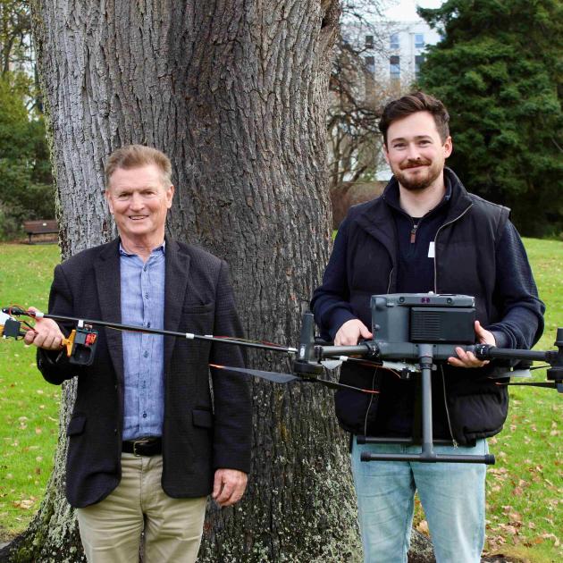 Prof Richard Green, left, and Dr Sam Schofield with the new chainsaw drone they’ve developed as...