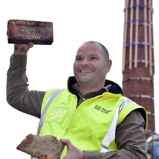 Project manager Paul Stevenson with a couple of the 4000 bricks rescued from the chimney of the...
