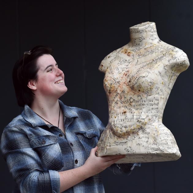 Otago Polytechnic student Emily Gilbert shows off the papier mache torso she created, at the...