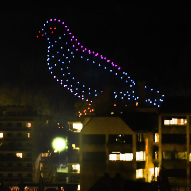 Drones form the shape of a bird seemingly perched on University of Otago buildings during a...