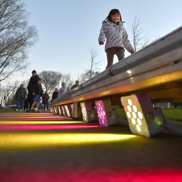 Sana Garner, 6, of Dunedin, takes a walk on the bright side.

