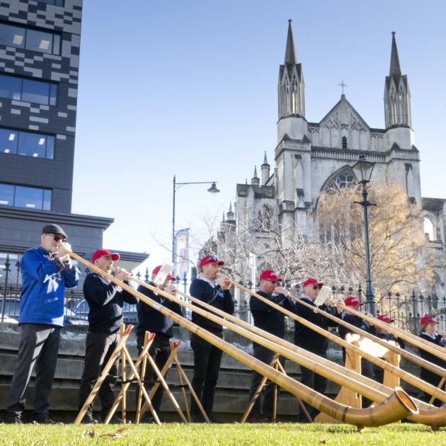 The Taranaki Swiss Club Alphorn Group performs in the Octagon, conducted by Alan Beck (below),...