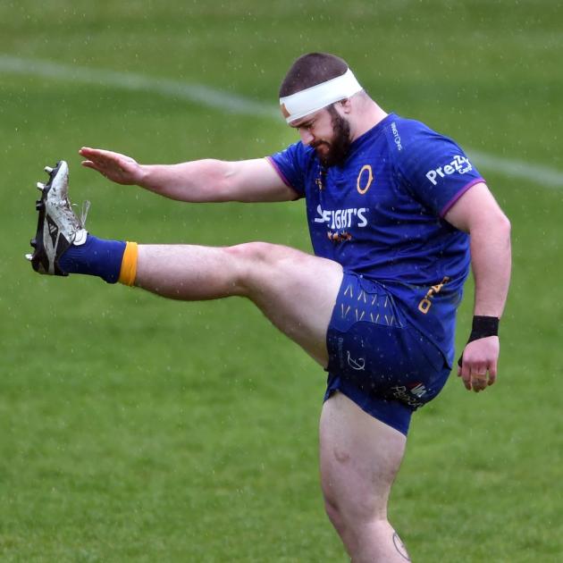 Otago prop Rohan Wingham warms up during a training session at Logan Park. PHOTO: PETER MCINTOSH