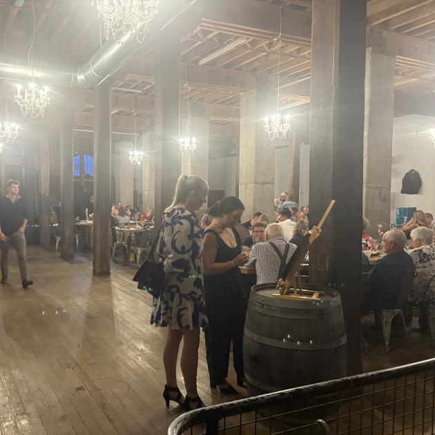 Ticket holders view the large range of silent auction items that were on offer before the live...