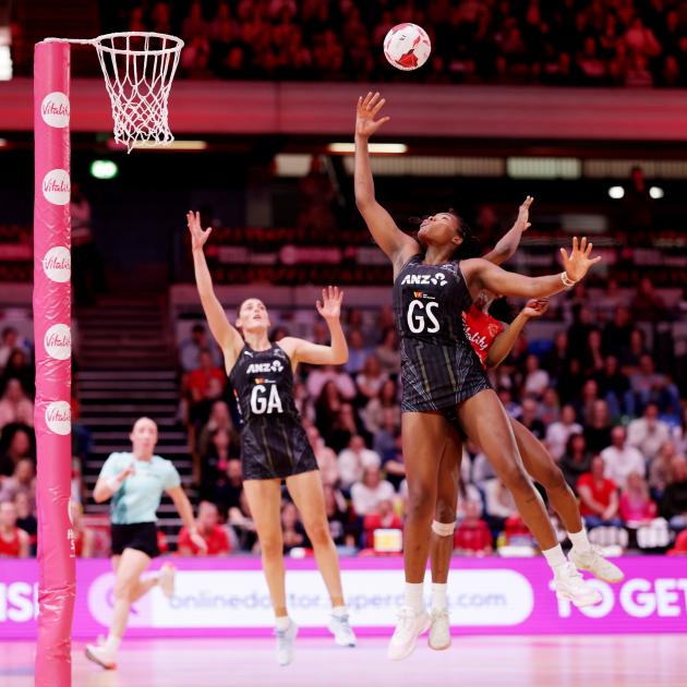 Grace Nweke takes the ball under pressure from England defender Funmi Fadoju. Silver Ferns goal...