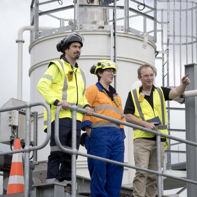 Discussing their work at the Tahuna wastewater treatment plant are (from left) plant supervisor...