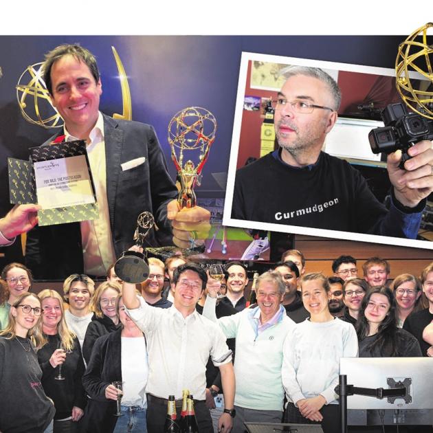 Developer Noel Park holds a previous trophy as Animation Research staff in Dunedin celebrate...