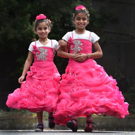 Former Syrian refugees Narjes (8) and Ayat (10) Jamal dressed up for a welcoming ceremony for new settlers at the Dunedin Centre yesterday. Photos: Peter McIntosh
