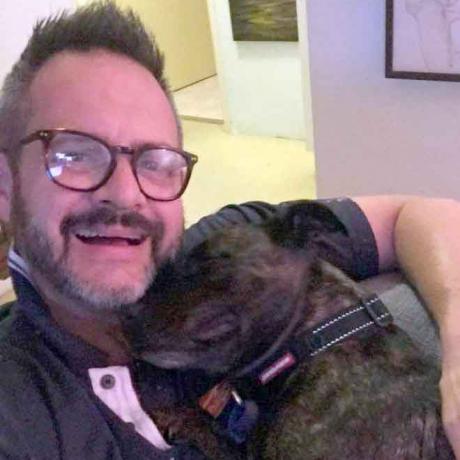 Leigh Cole is ecstatic to be reunited with his English staffy dog Evie four days after she...
