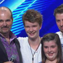 Bryan Townley, pictured with children Harry (left), Maggie and Jack, dedicated his song to his late wife. Photo / TV3 