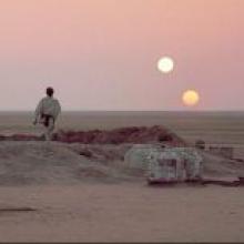 Luke contemplates the double sunset. Luke contemplates the double sunset.