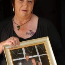Carol Radnoty, with a photo of her and her late partner, Steve Radnoty, who died after an early morning assault in an inner-city fast-food outlet last month. Photo by Stephen Jaquiery.