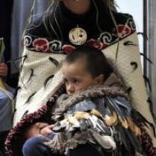 Te Whitu Rangi takes a break on  the knee of his grandmother, April Mokomoko, of Moeraki. Photo by Gerard O'Brien.