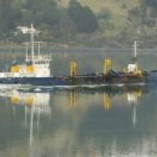 Port Otago’s suction dredge New Era glides up Otago Harbour laden with sand destined for Middle Beach in July last year. Photo by Gerard O'Brien