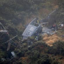 Three men died and one was seriously injured when the RNZAF Iroquois helicopter crashed near Pukerua Bay. Photo / Mark Mitchell 